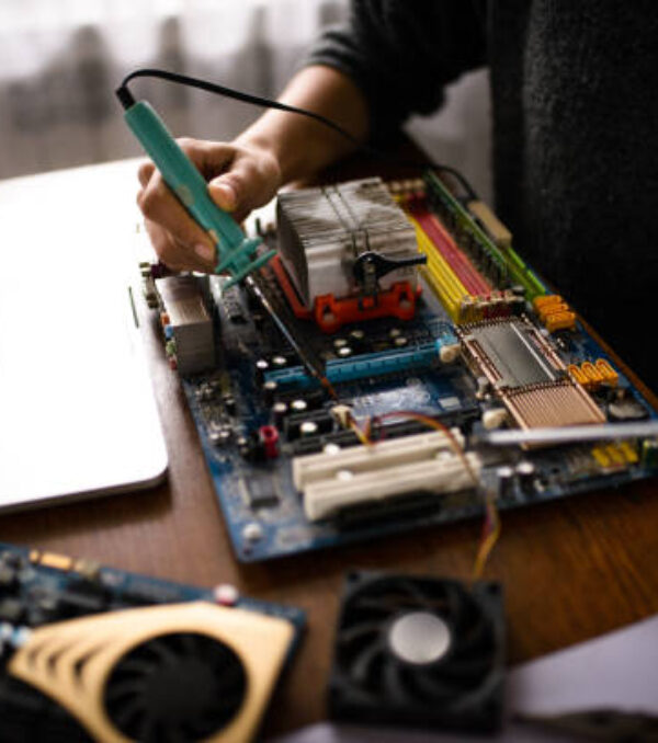 Close up of a woman hands repairing computer